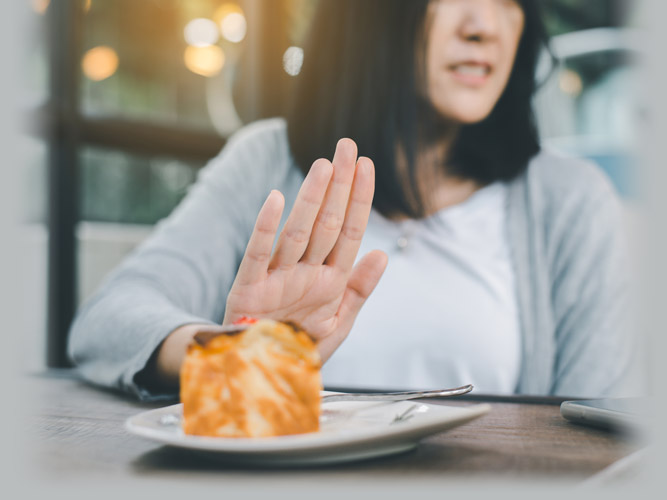 Woman Avoiding Unhealthy Foods